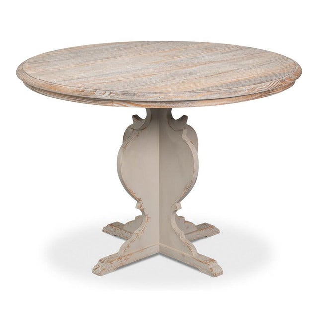 Natural pine above an antiqued white base recalls the practical two-tone furniture of an old French cafe, with bare wood...