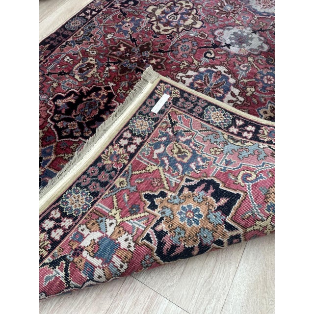 A superb example of mid-20th-century textile craftsmanship, this vintage Karastan rug (circa 1960s) features a...