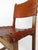 Set composed of six chairs in solid carved oak and studded cognac leather probably produced at the beginning of the...