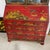 This beautiful red secretary/ bookcase on desk has the rare feature of eglomise painted mirror doors with birds, figures...