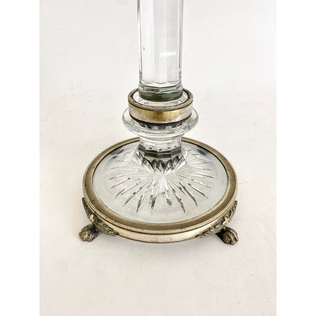 This pair of rare English S. Clarkes Cricklite candelabras feature brass and crystal bases including a starburst framed in...