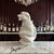 A whimsical Italian ceramic monkey pitcher produced by R.E.M. and dated 1975. Executed in glossy white glazed pottery with...