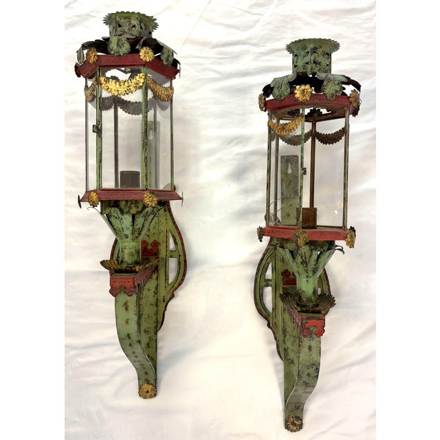 Unique pair of vintage Italian Venetian style candle wall sconces. They are made of metal tole painted in shades of green,...