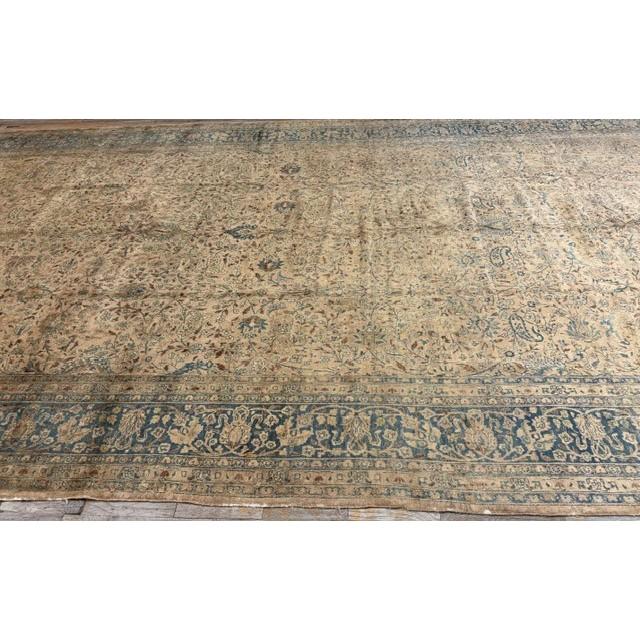 "This is a spectacular and exceptionally rare monumental antique Mashad rug, dating back to circa 1900. Measuring an...