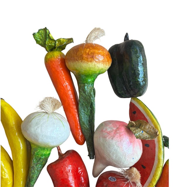A charming and incredibly realistic set of 22 vintage papier-mâché fruits and vegetables, beautifully hand-crafted and...