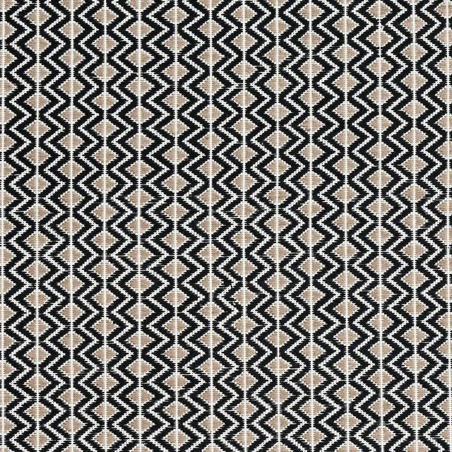 This small-scale geometric is handwoven by master Maya craftsmen using centuries-old techniques for a graphic sensibility...