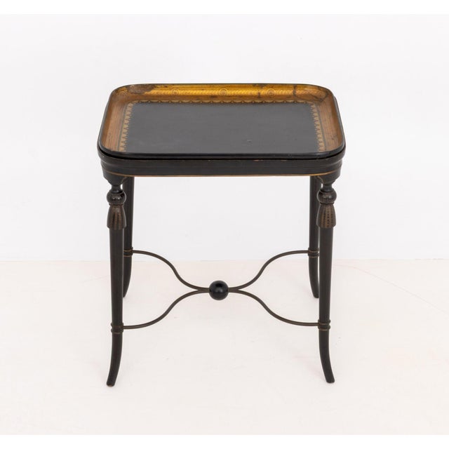 Regency Style Black Lacquered Wood Tray Table, with gilt geometric design to the removable tray top above four tapered...