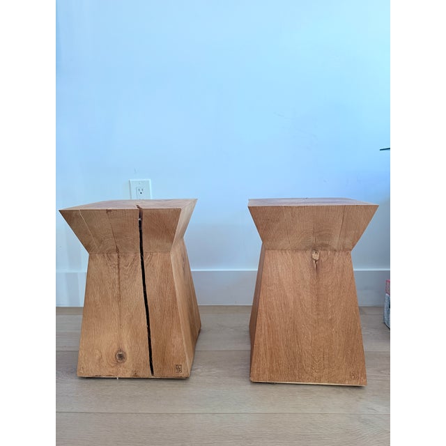 An authenticated pair of Nagato side tables by Christian Liaigre, crafted from solid white oak and bearing the designer's...