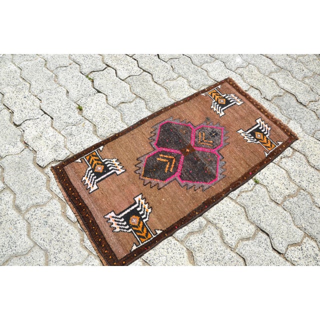 This is a vintage Turkish Oushak rug from the 1960s. The piece was hand-knotted.