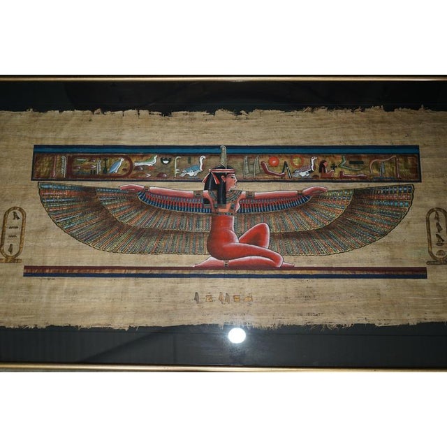 Exceptionally decorative large Egyptian hand-painted papyrus depicting the ancient Egyptian goddess Isis with her...