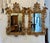 A striking and highly decorative pair of antique giltwood wall mirrors beautifully carved in the Rococo revival manner...
