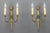 Pair of French Art Deco brass twin arm sconces from ca. 1930. This elegant pair of brass sconces has a beautiful brass...