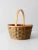 This is a vintage splint weave basket. With soft green and orange tones, the round tote adds a nice pop of color as it...