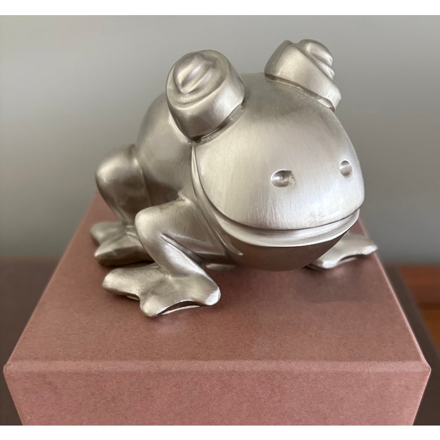 A sculptural metal frog by Romeo Sozzi for Promemoria, part of the brand's signature "Frogs and Games" collection. The...