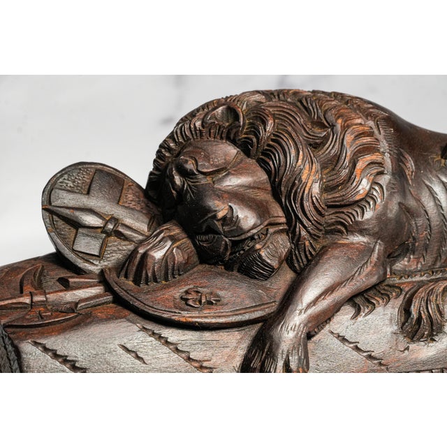 A remarkable and highly decorative mid-19th century Grand Tour carved wood souvenir depicting the legendary Lion of...