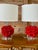 A striking pair of table lamps featuring sculptural faux coral bodies in vibrant red resin. The richly textured coral...