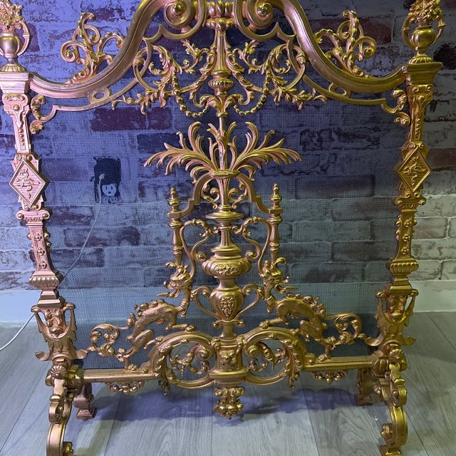 Elegant antique French Louis XVI–style fireplace spark guard crafted in heavy gilt ormolu with exquisite hand-finished...