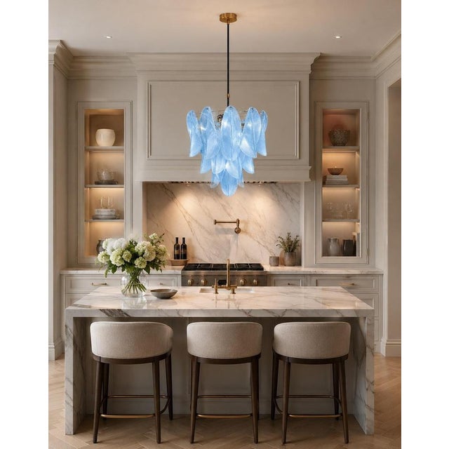 Trio Murano chandelier.s Each fixture is made up of 23 individual handblown trasparent glass elements hanging from a...