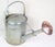 A traditional English garden watering can. It is made of iron with a copper water rose and has been professionally cleaned...