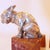 A pair of art deco bookends in the form of two stylised french bulldogs sitting on red marble, angled plinths. Signed r c...