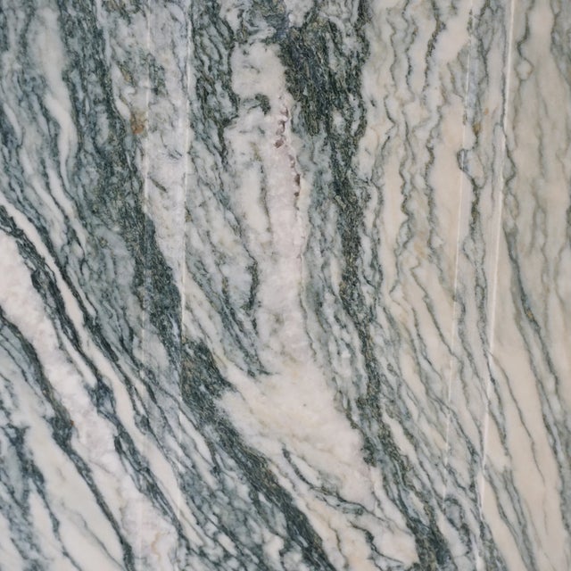 16.25"h, 57.75"w, 39.25"d - Green and beige marble, possibly Cipollino marble - One eye-shape slab that rests on two...