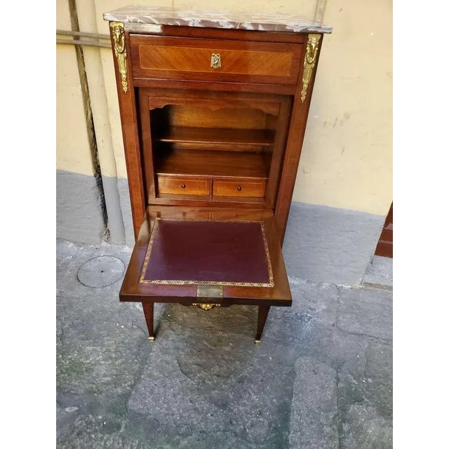 Napoleon III secretary desk in rosewood and boxwood, of beautiful quality. The interiors of the drawers are in oak, with...