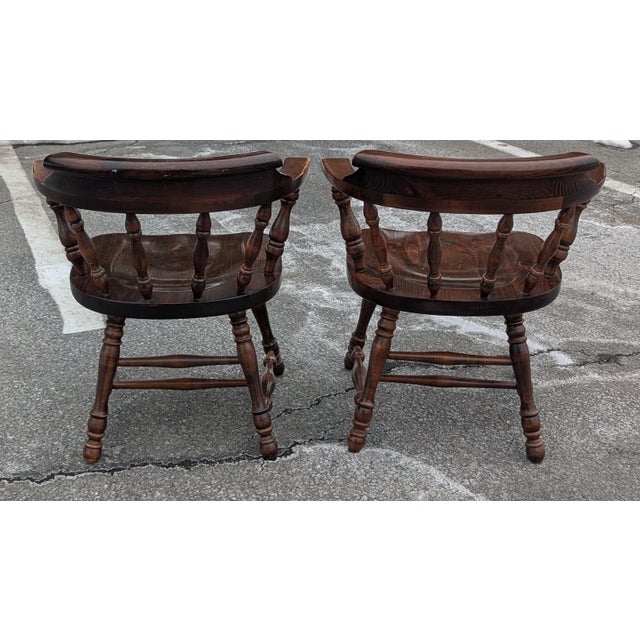 Elevate your dining space with this handsome pair of "Old Tavern" collection dining chairs by the venerable Ethan Allen....