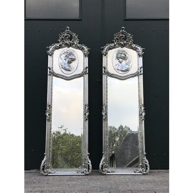 This impressive pair of mid-20th-century Italian Rococo-style full-length mirrors combines dramatic sculptural decoration...