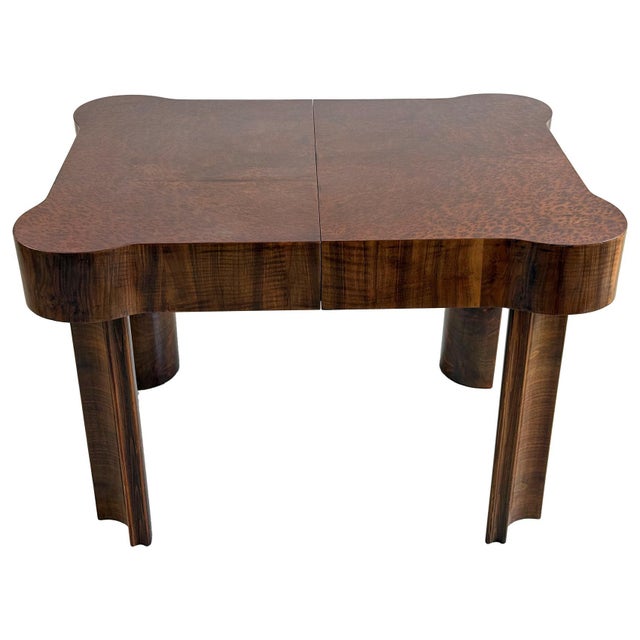 An exceptional Art Deco extending dining table from the 1930s, distinguished by its elegant rounded-corner top and...