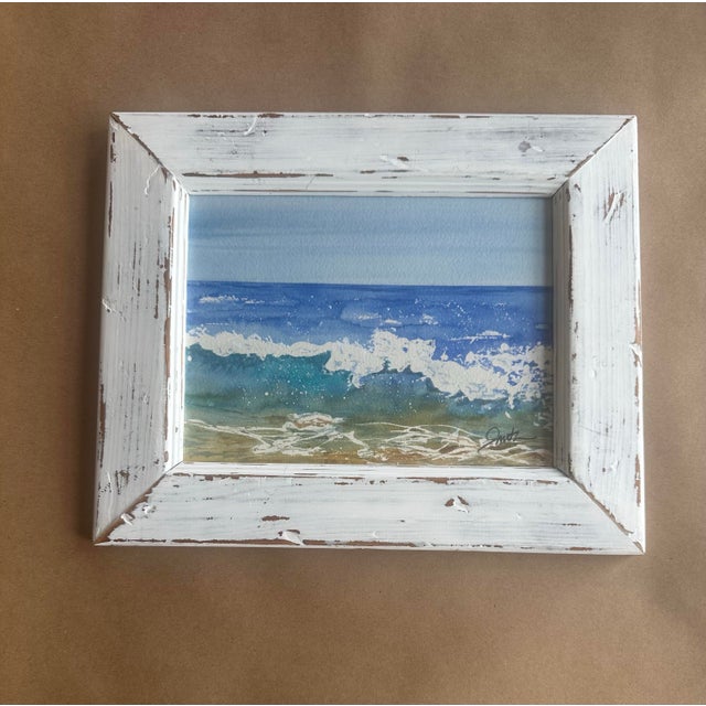 An original watercolor seascape capturing the energy and serenity of ocean waves rolling onto shore. Soft gradients of...
