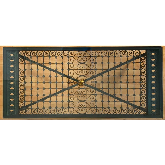 Elegant Wrought Iron Coffee Table With Glass Top and Gilt Accent A refined and well-proportioned wrought iron coffee table...