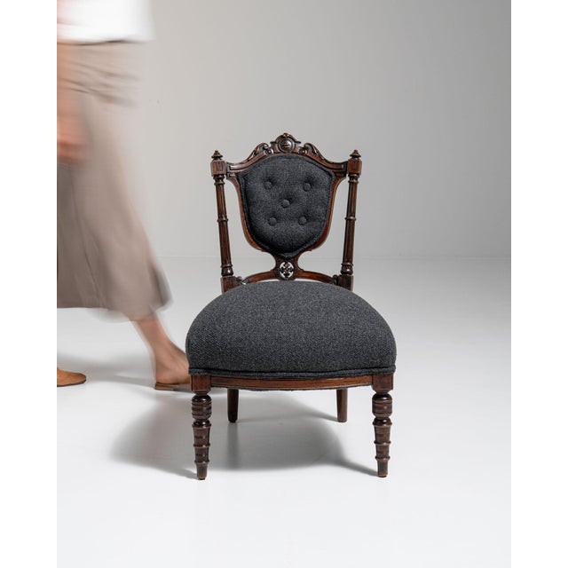 Carved wood side chair in Charcoal Grey. Its charcoal grey finish sets off upholstered button-tufted back in charcoal...