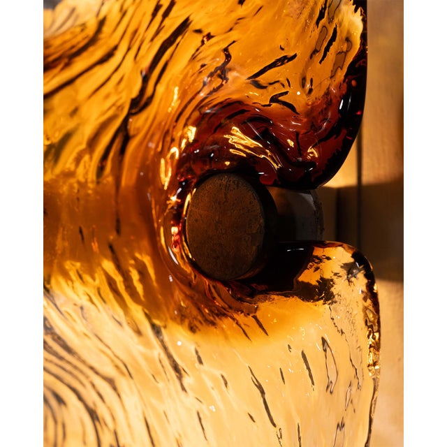 Sculptural wall lamp designed by Toni Zuccheri for Venini, Italy, 1960s. Small Size. Executed in thick, hand-formed Murano...