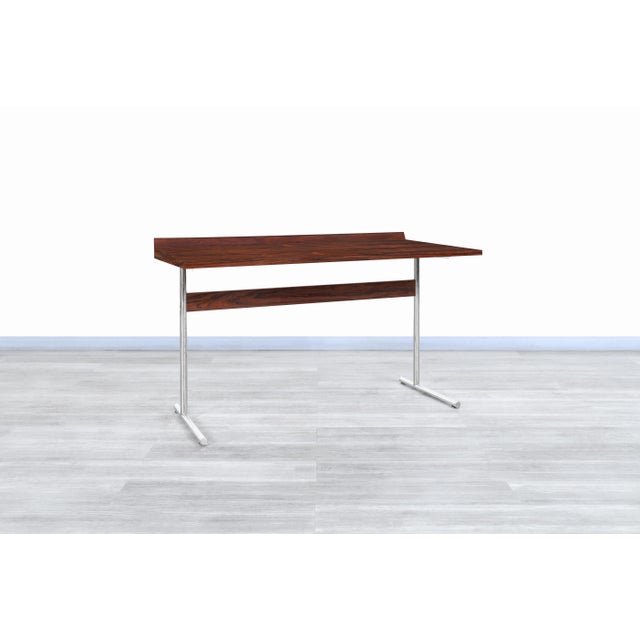 Wonderful mid-century rosewood “Omega” desk designed by Hans Eichenberger for Haussmann and Haussmann in Germany, circa...