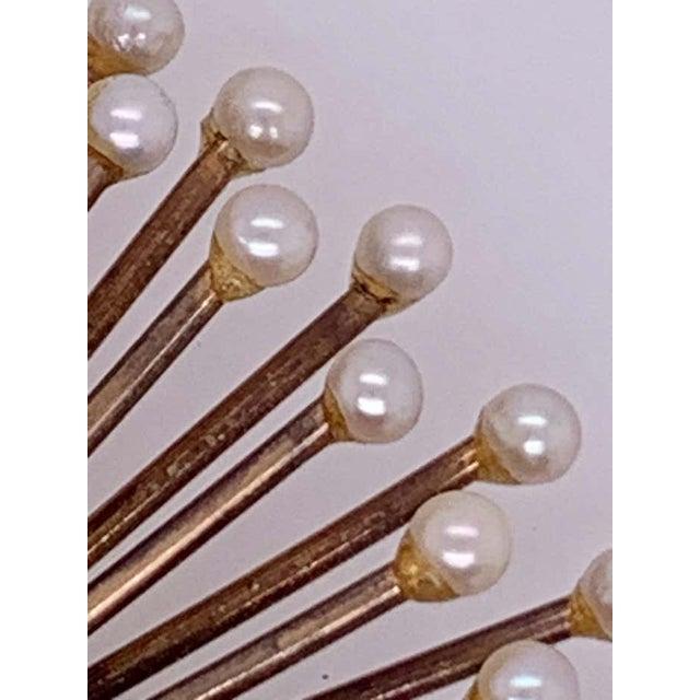 An Art Deco Fan Brooch / Pin. Diamond and Pearl in 14K Yellow Gold. The center cluster of pearls approximately 3.3mm in...