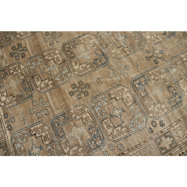 A 20th century one of a kind afghan Ersari rug with an all-over tribal motif on a soft brown field, accents in beige,...