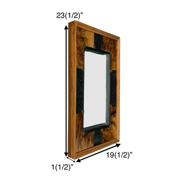 This product is a vintage custom mirror made of heavy wood with cowhide leather accents, giving it a unique and rustic...