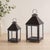 Elevate your home or garden with this timeless set of footed iron lanterns. Crafted with a durable metal frame and a sleek...