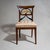 Biedermeier side chair with an upholstered seat and a stained beechwood frame. The unusually designed backrest features...