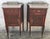 20th French Mid-Century Modern pair of nightstands with glass top and bronze crest.