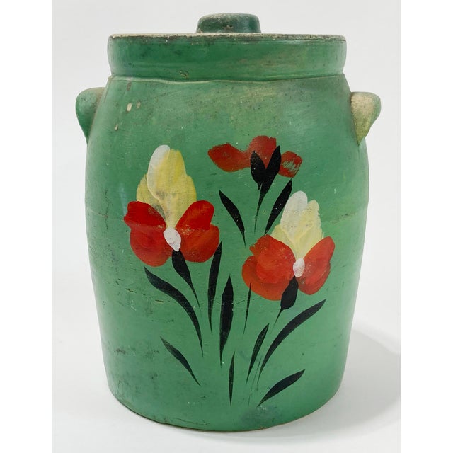 Antique farmhouse style lidded crock glazed in bright green. Features vibrant hand-painted floral motif. Marked USA on...