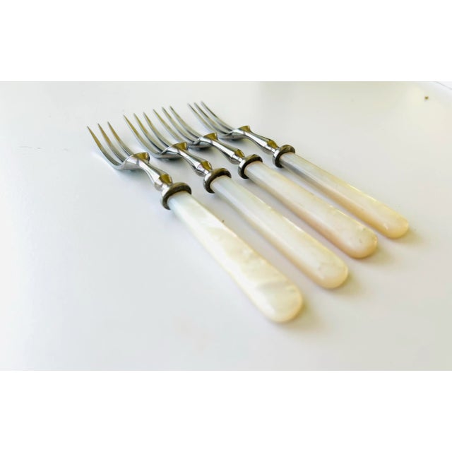 Midcentury Set of 4 Mother of Pearl handle with stainless steel pastry, dessert forks 5.75"L in Very good condition.