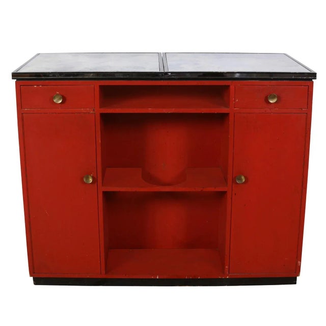 Mid Century mirrored James Mont bar with a diamond motif on front, red interior and expandable top