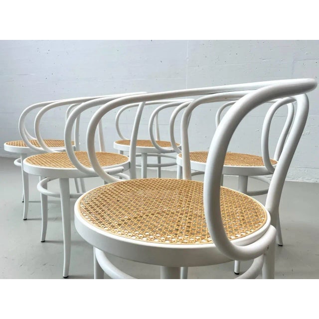 The chairs shown here are thonet 209 bentwood chairs with armrests and seats made of viennese wickerwork. This model is...