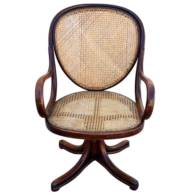 Victorian bent oak & cane number 11 oak swivel desk chair by Thonet features an elegant, sculptural frame crafted from...