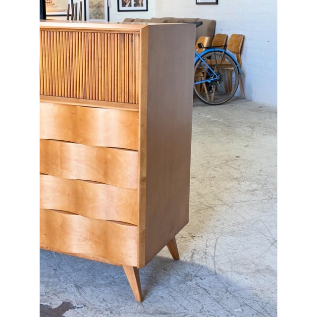 Newly refinished vintage highboy dresser by Edmund Spence, featuring beautifully sculpted wavy drawers, a tambour sliding...