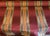 17 yards of rich and luxurious stripe fabric in burgundy, gold, orange and purple. Upholstery grade fabric.
