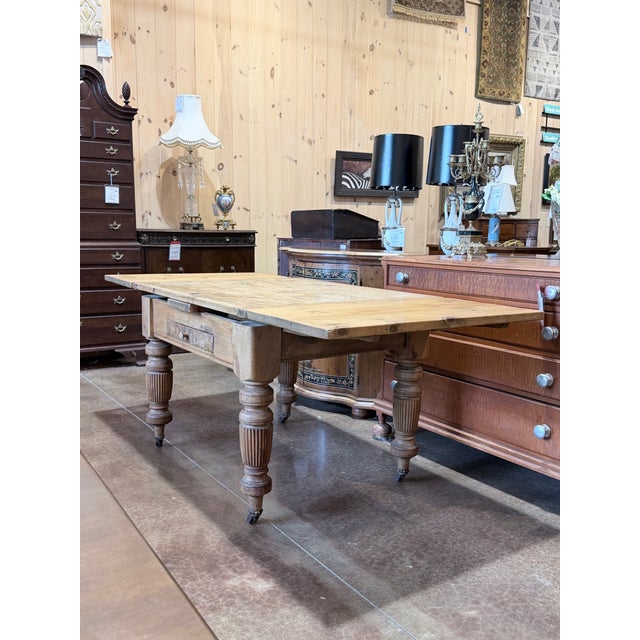 A wonderfully authentic primitive farmhouse table showcasing the warmth, character, and craftsmanship of early American...