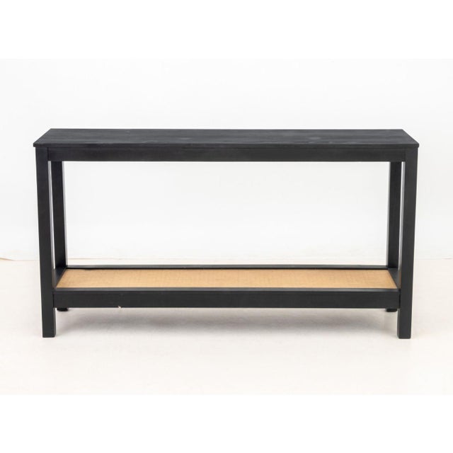 Contemporary Ebonized Wood Console Table, with rattan inset undertier. 32" H x 60.25" W x 16" D. Provenance: From a New...