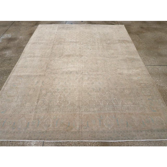 A wool pile of asymmetric knots on a cotton foundation. The lightly drawn and accented allover Herati-inspired pattern is...